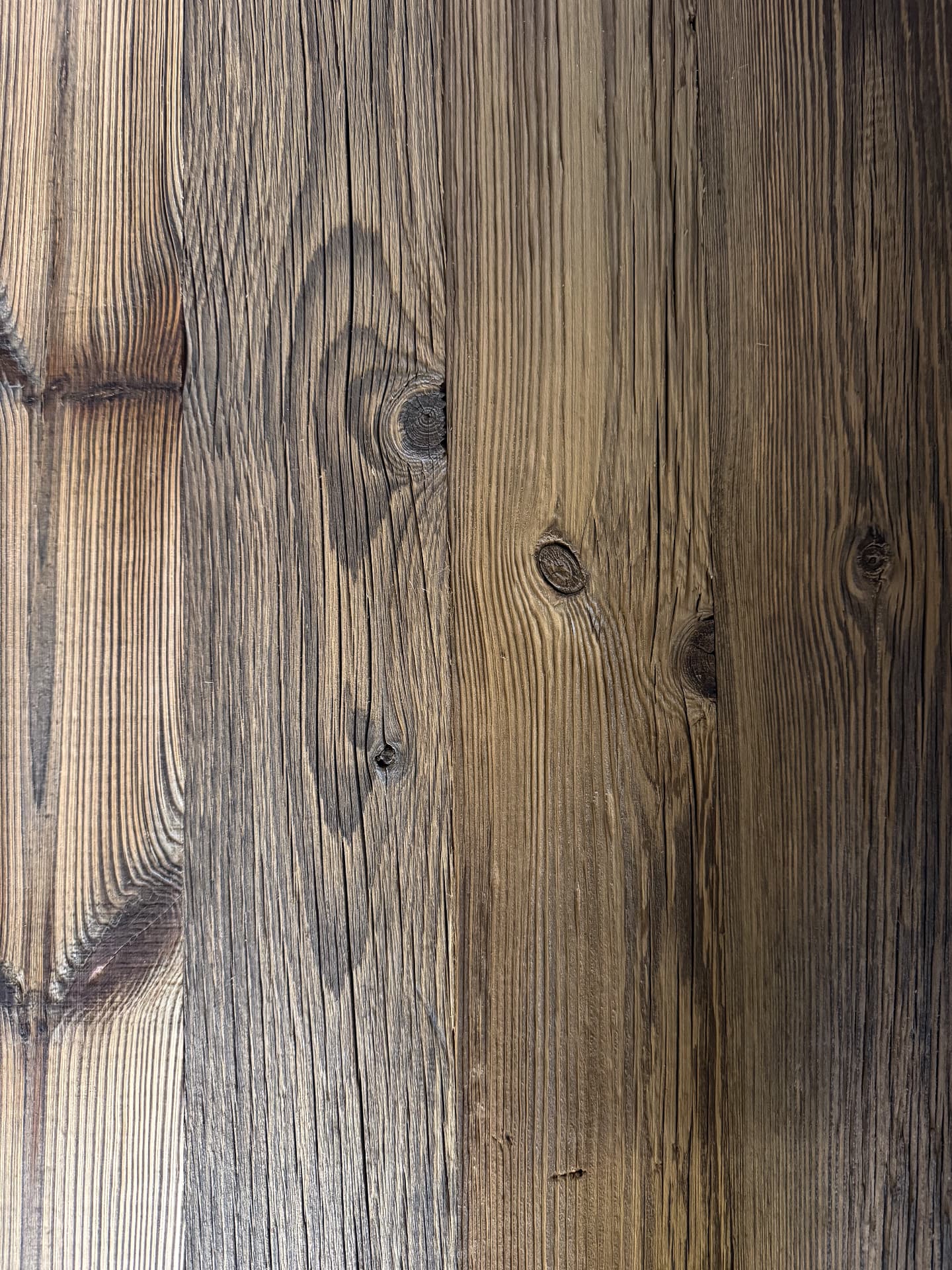 Brushed reclaimed timber boards with weathered grain, knots and natural variation