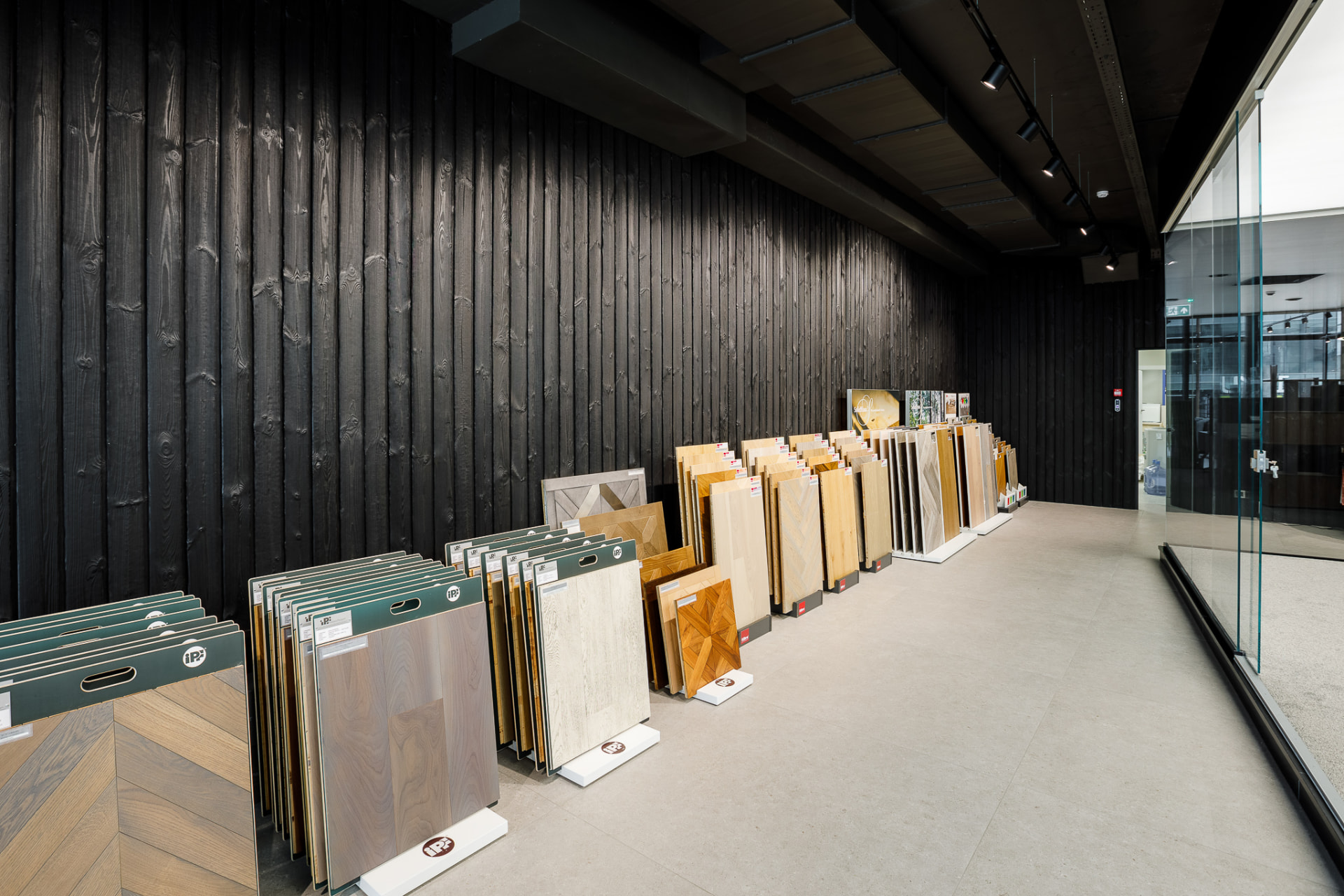 Interior showroom with a black Shou Sugi Ban timber feature wall